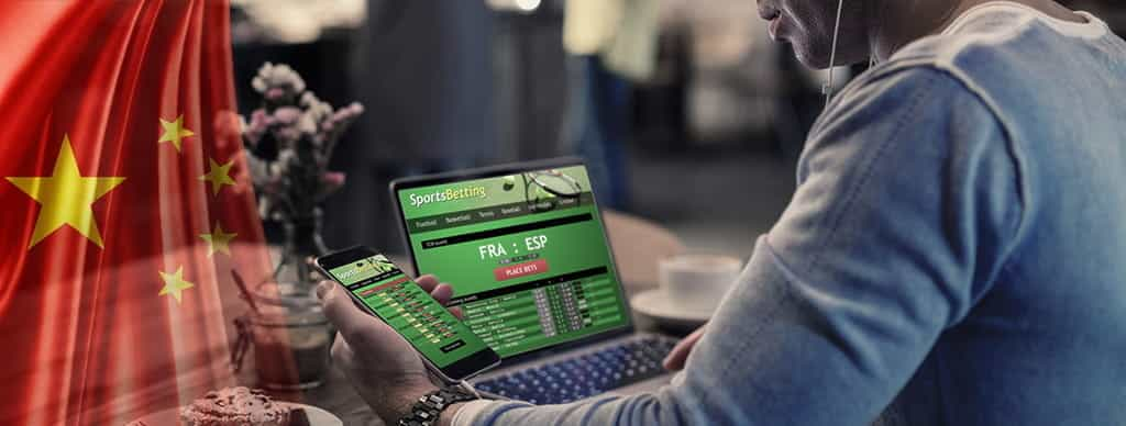 La bandiera cinese e un laptop connesso ad un sito di betting